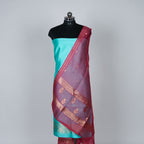 Teal Green Banarasi Handloom Luxury Suit set contrast with cherry pink color.