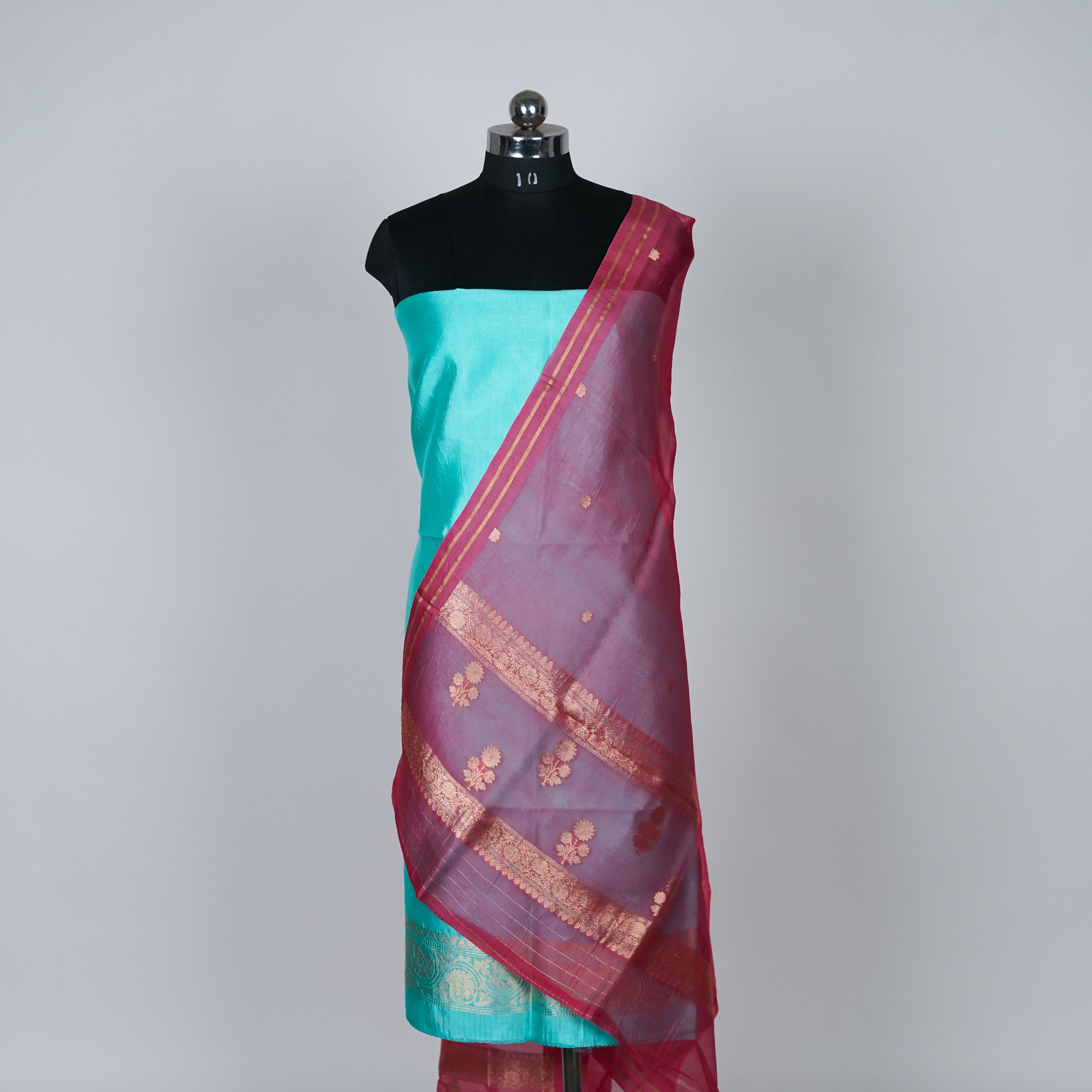 Teal Green Banarasi Handloom Luxury Suit set contrast with cherry pink color.