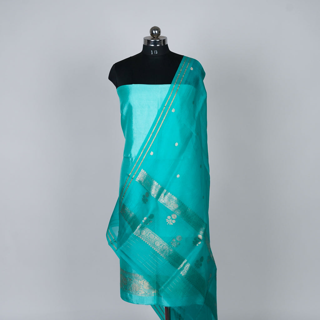 Teal Green Banarasi Handloom Luxury Suit set contrast with similar teal green color.