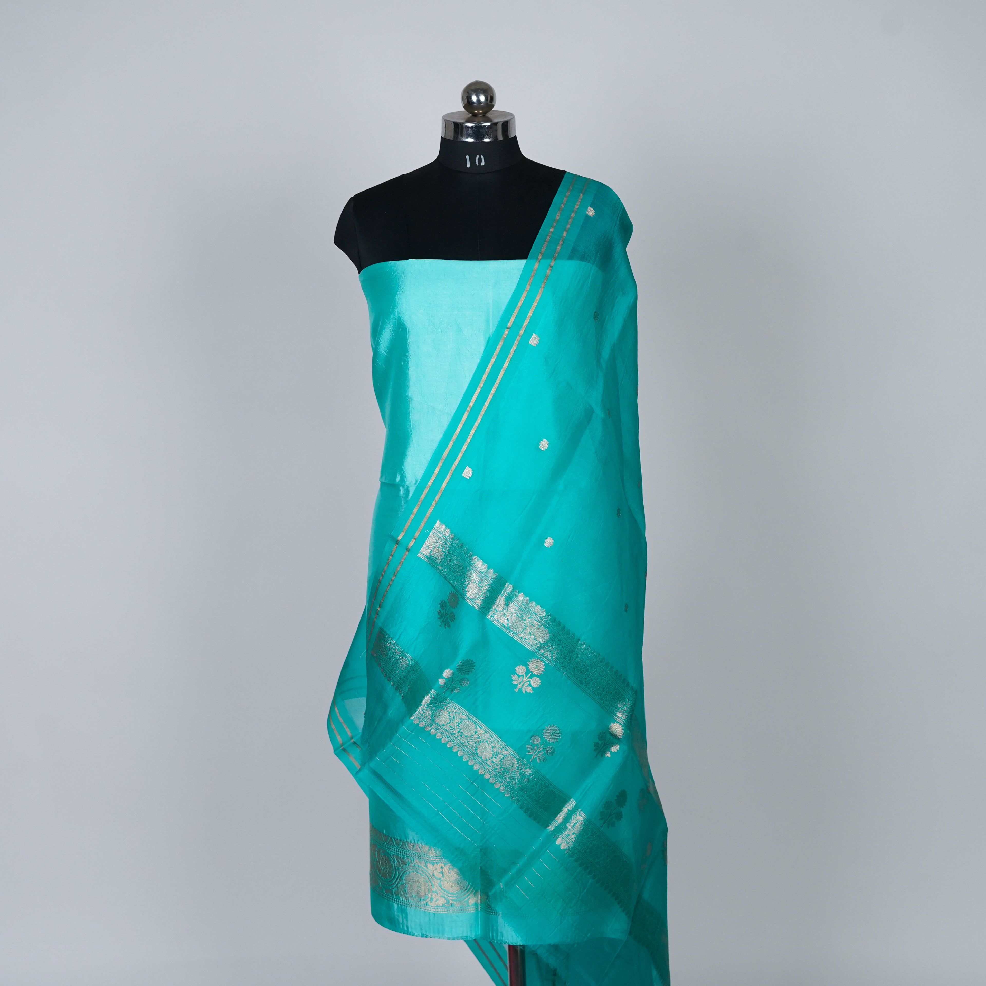 Teal Green Banarasi Handloom Luxury Suit set contrast with similar teal green color.