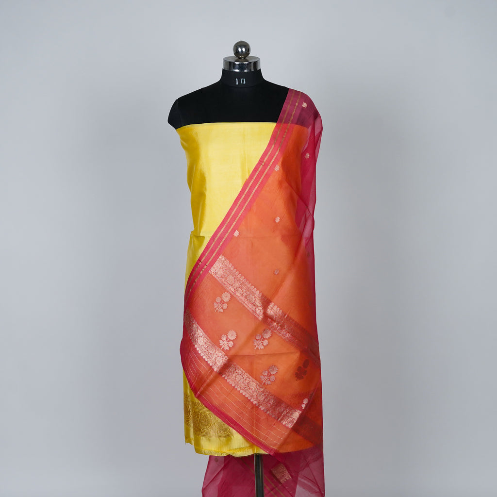 Yellow Banarasi Handloom Luxury Suit set contrast with light pink color.