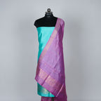 Teal Green Banarasi Handloom Luxury Suit set contrast with pink color.