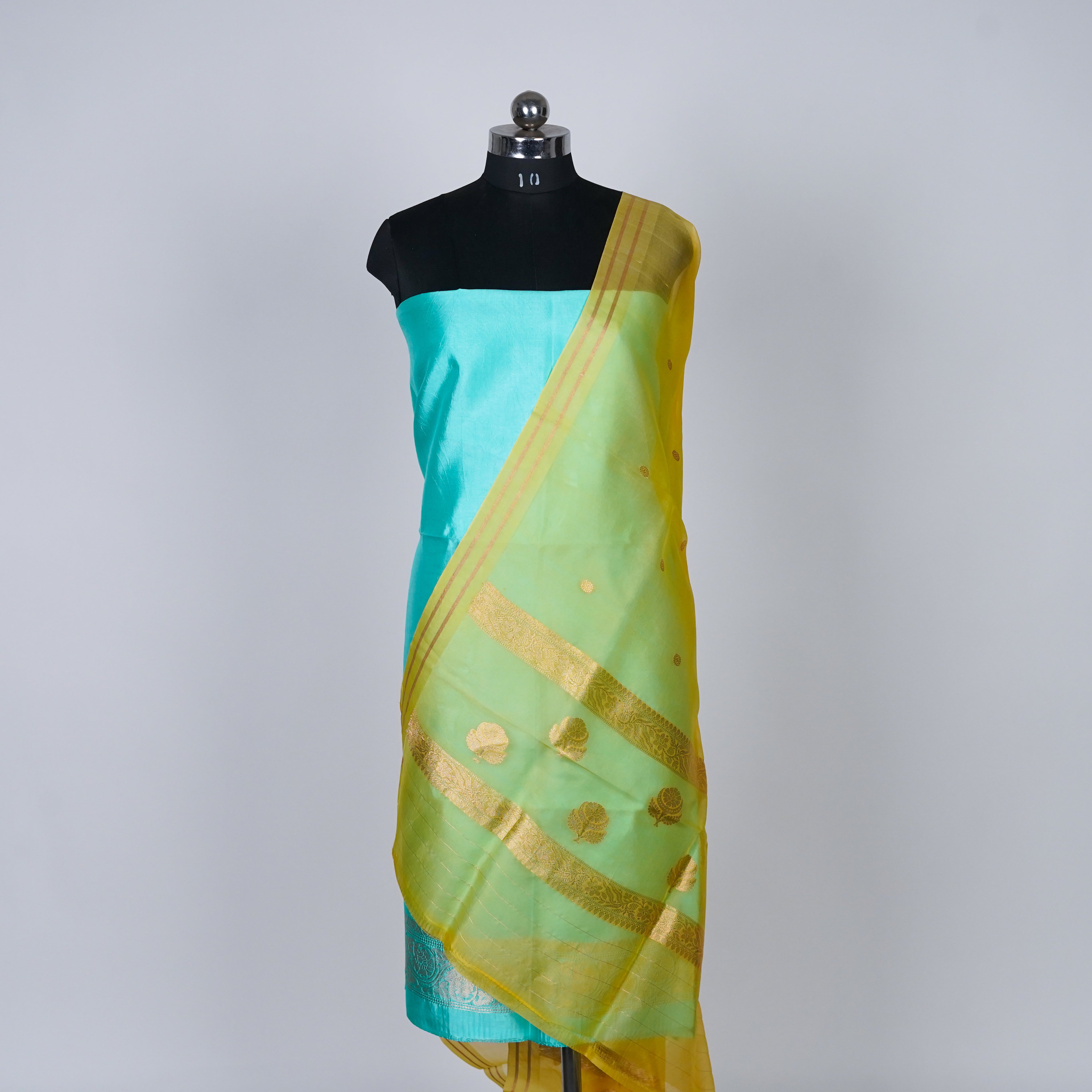 Teal Green Banarasi Handloom Luxury Suit set contrast with soft lemon Yellow color.
