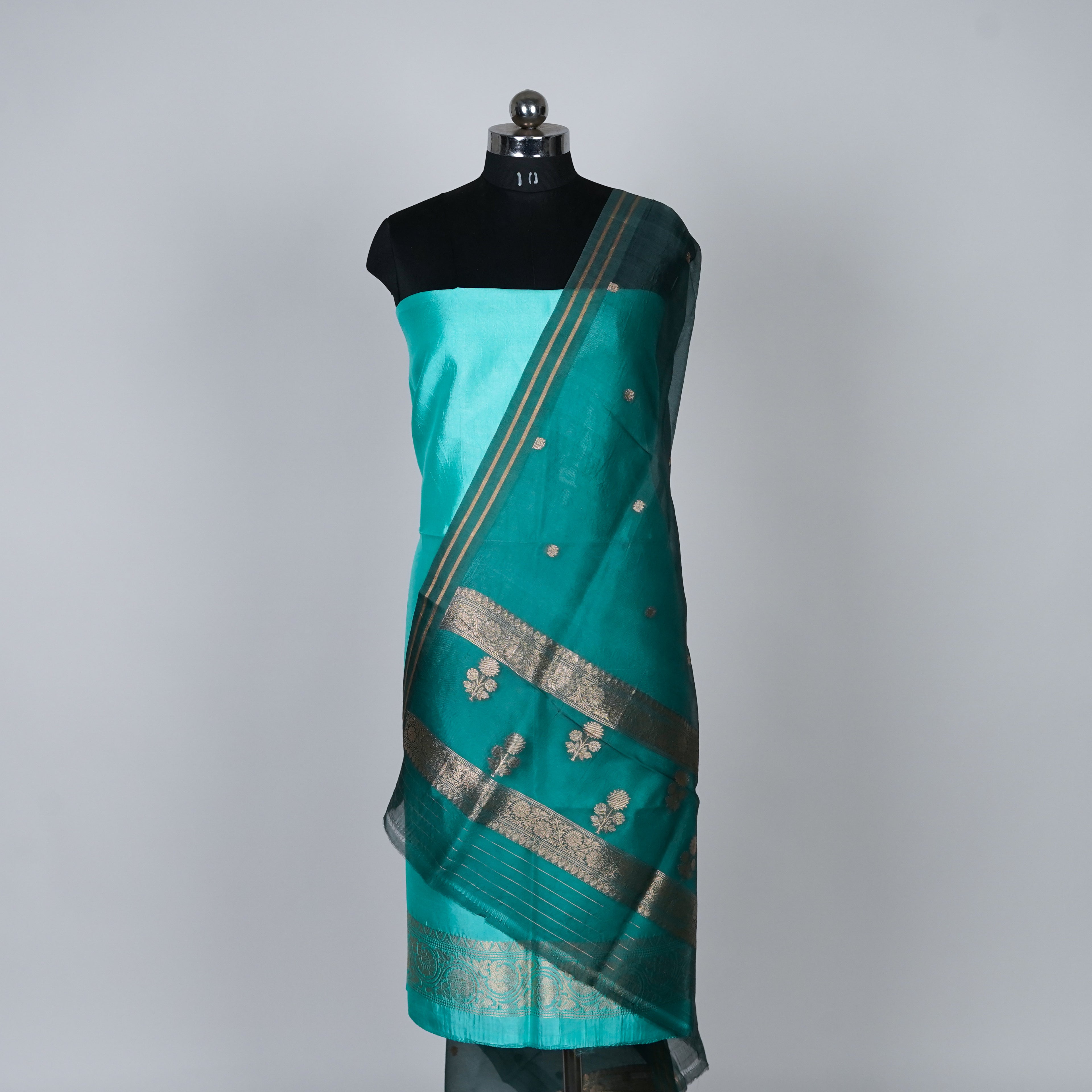 Teal Green Banarasi Handloom Luxury Suit set contrast with emerald Green color.