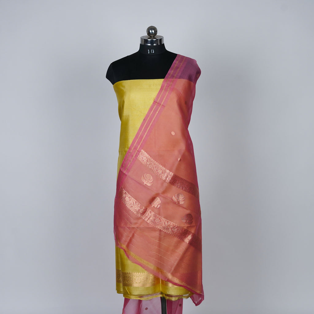 Yellow Banarasi Handloom Luxury Suit set contrast with Cherry pink color.